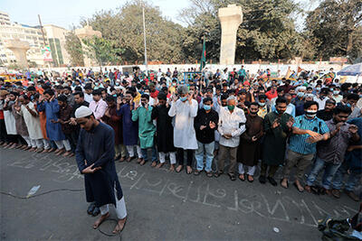 large crowd of people mourning